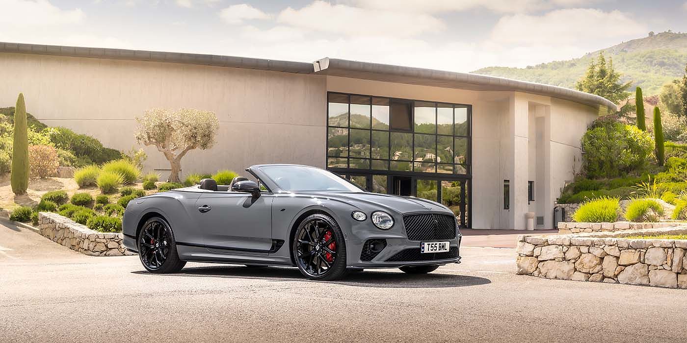 Bentley Newcastle Bentley Continental GTC S convertible in Cambrian Grey paint front 34 static near house
