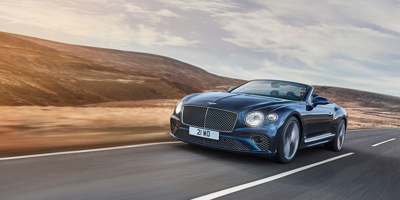 Bentley Newcastle Bentley Continental GTC Speed convertible in Peacock paint side front 34 dynamic