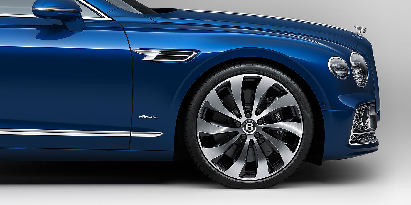 Bentley Newcastle Bentley Flying Spur Azure sedan side close up in Sequin Blue paint with Azure badge